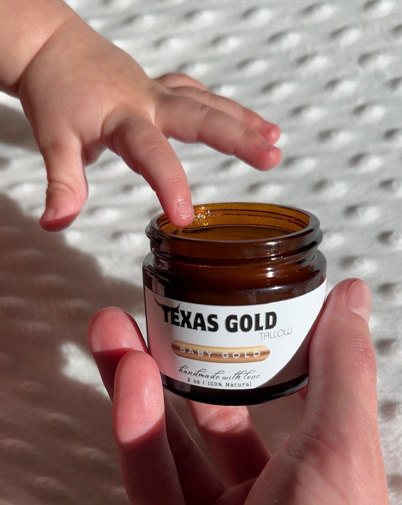 Baby Gold Tallow Balm Texas Gold Tallow Grass fed and grass finished beef tallow great for sensitive skin and eczema babies finger dipping in jar